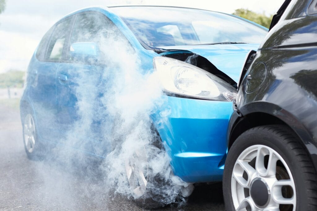 Close Up Of Two Cars Damaged In Road Traffic Accident